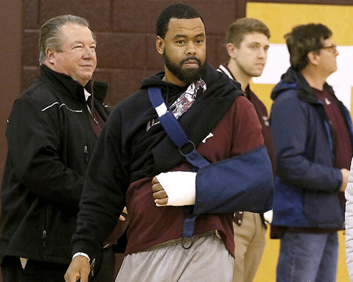 Woodrow Wilson assistant coach Gene Nabors makes his way to his team's bench prior to the start of the Lady Flying Eagles' home game against Hurricane February 13, 2020 with his arm in a cast and sling following the incident at Greenbrier East earlier that week.Register-Herald File Photo